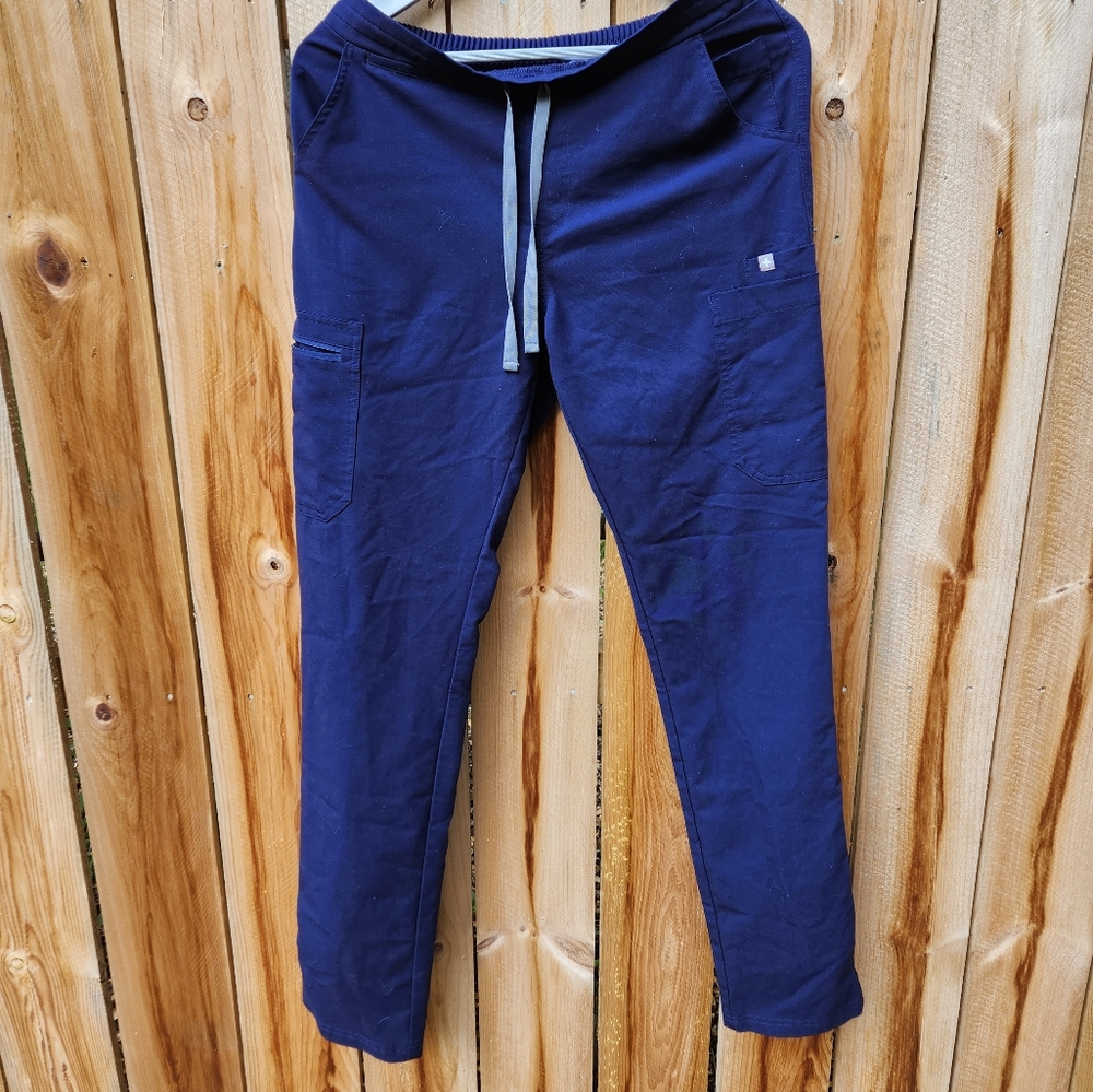 FIGS navy scrubs.